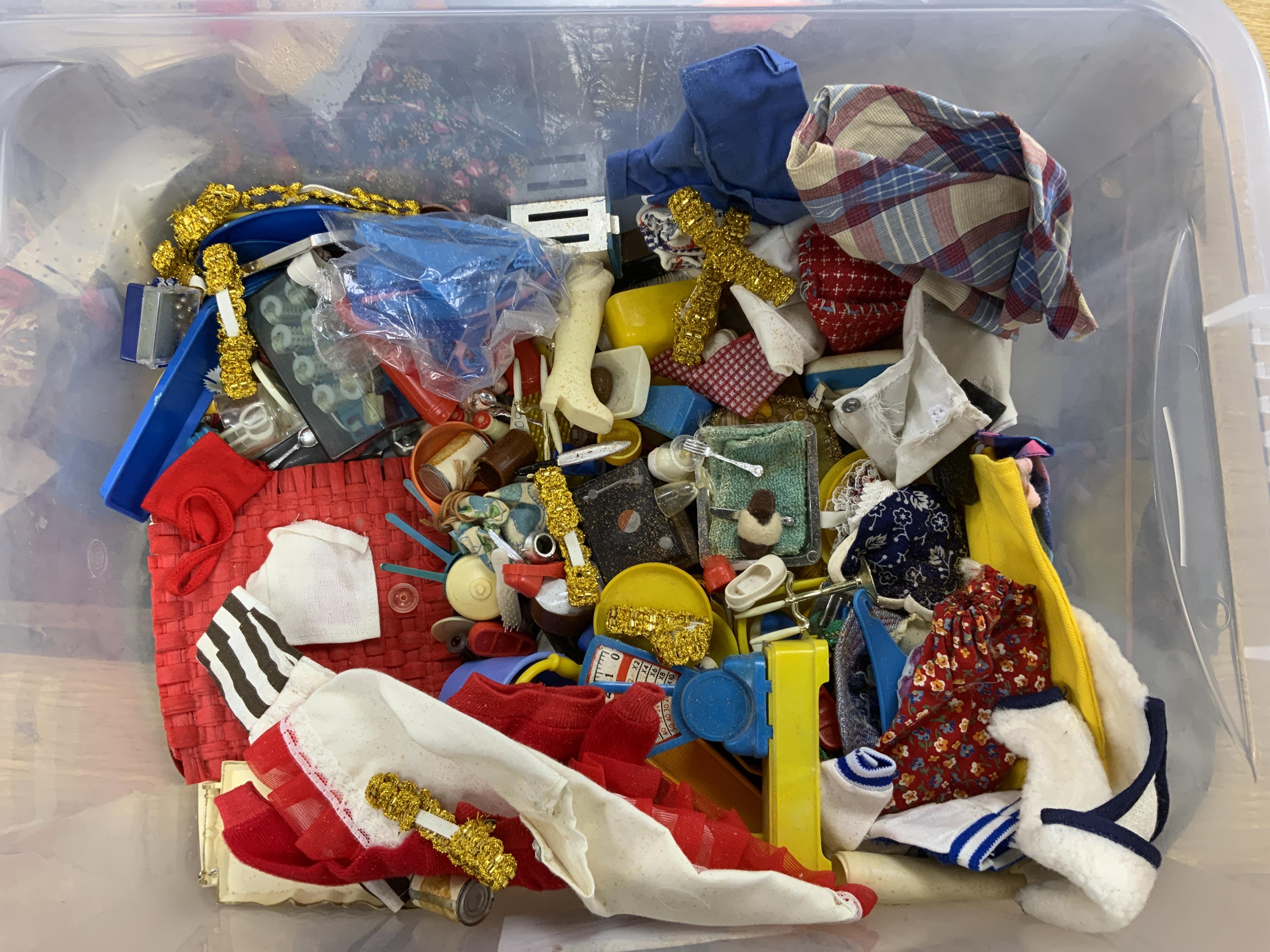 A collection of 1960s-80s Sindy dolls and accessories, including; five dolls, an early plywood and hardboard caravan, a large selection of clothing and accessories, furniture, house fittings, including a shower, wardrobe